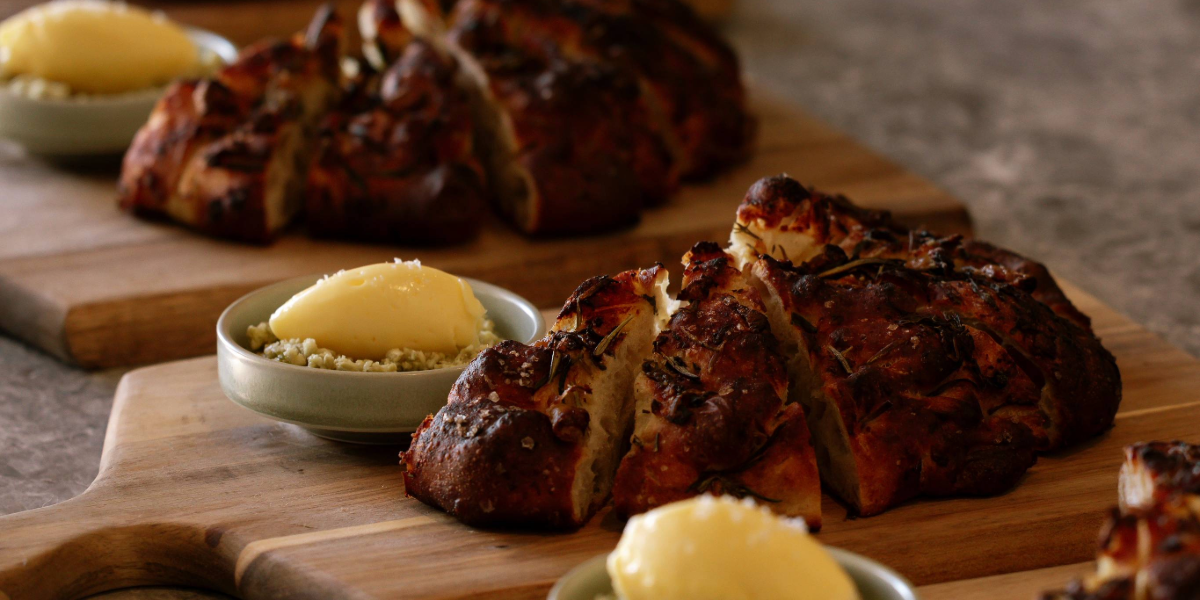 Focaccia loaf with a side serving of butter
