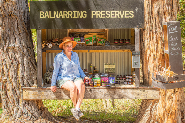 Farmer at her farm gate