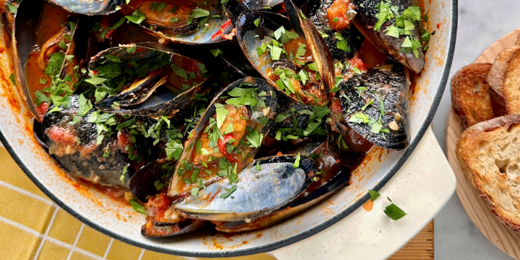 Pot of mussels served with crusty bread