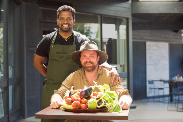 Chef and farmer with freshly harvested produce.